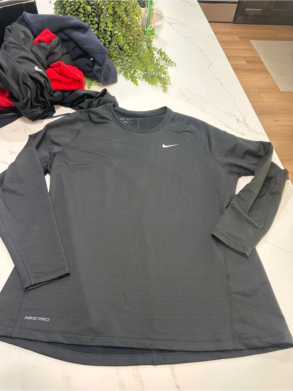 Nike Black Long Sleeve Performance Top with White Swoosh